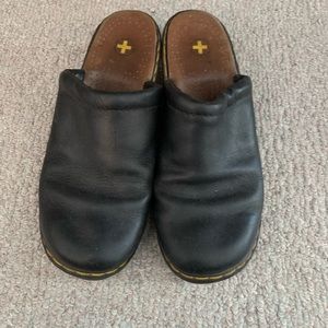 Dr. Martens black leather clogs